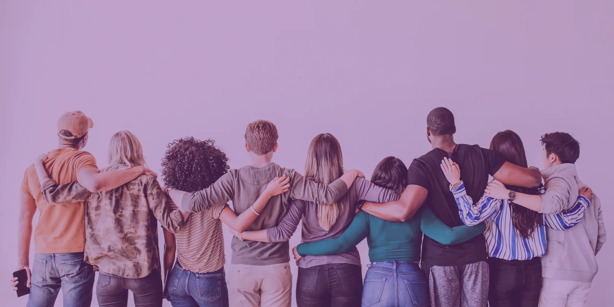 Group of people with arms around each other's shoulders, representing community and connection